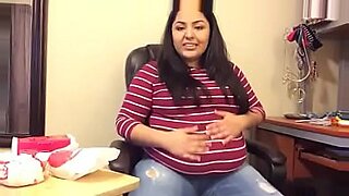 huge pregnant belly in blue dress